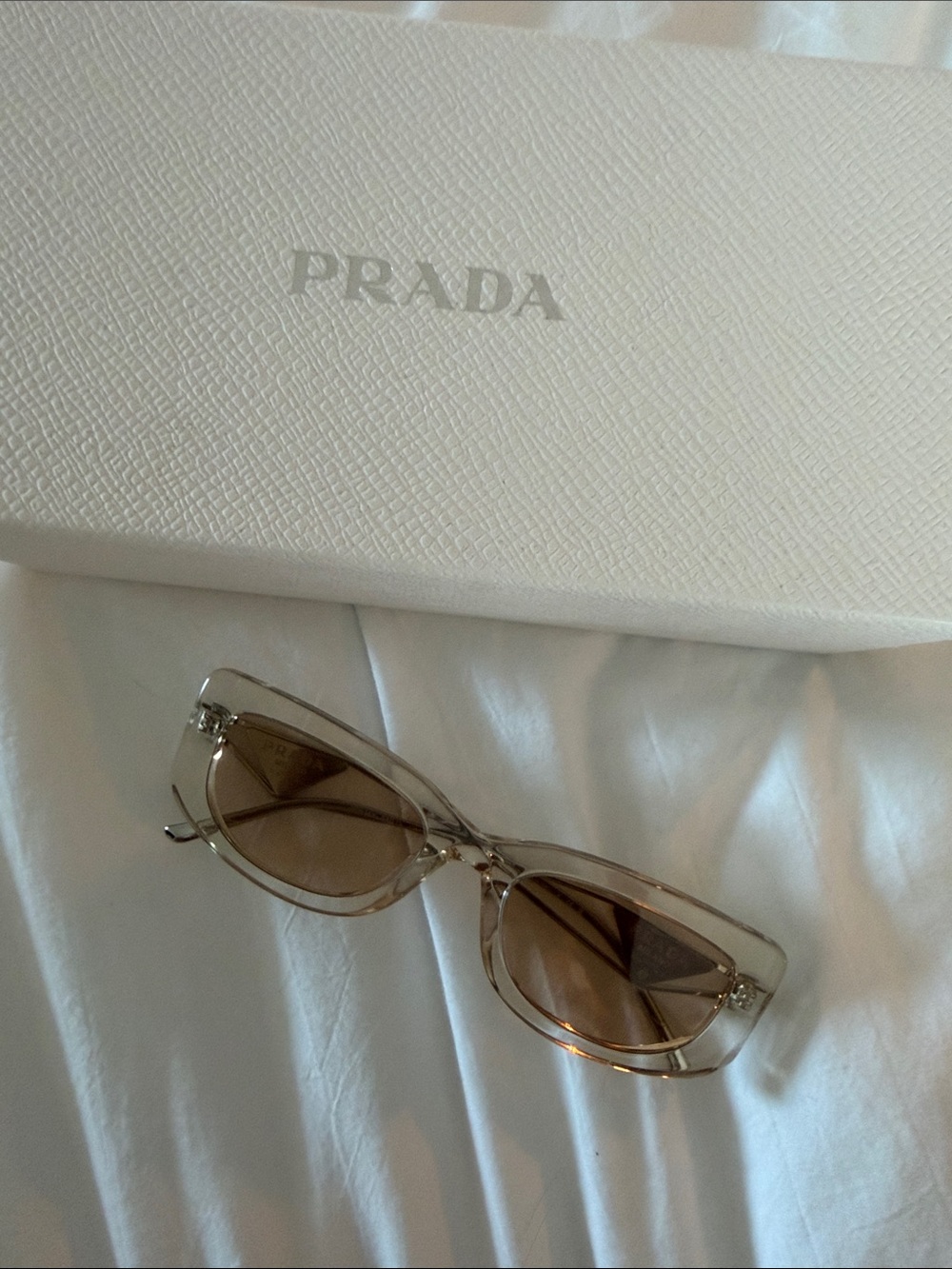 Prada Women’s Clear Frame Sunglasses with Brown Lenses